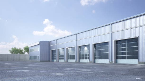 Commercial warehouse building with multiple aluminum and glass overhead bay doors